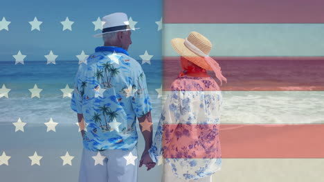 animation of flag of usa over diverse senior couple on beach in summer