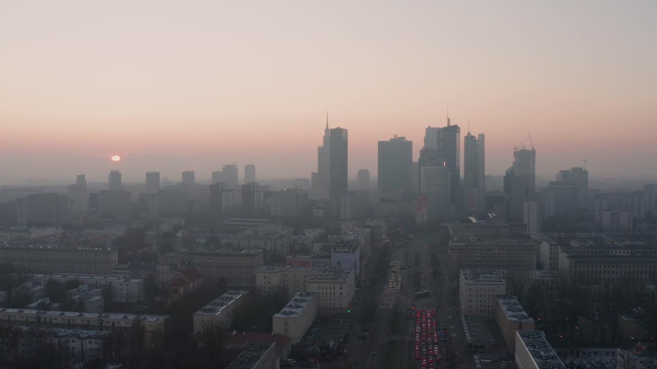 Sun rising on a foggy morning in Warsaw. Aerial drone fottage