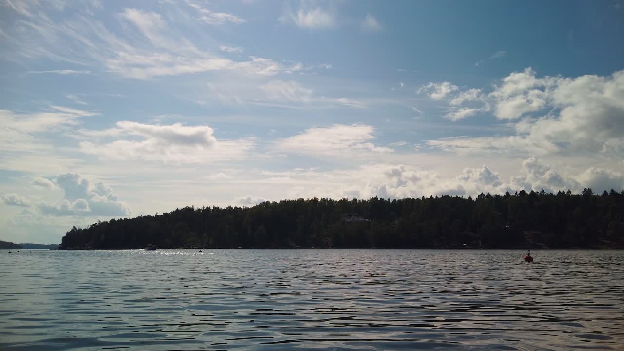 Nature Silhouettes With Buoys Floating On Baltic Sea Water In Stockholm Archipelago. Timelapse