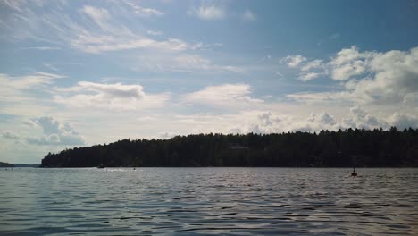 nature silhouettes with buoys floating on baltic sea water in stockholm archipelago. timelapse
