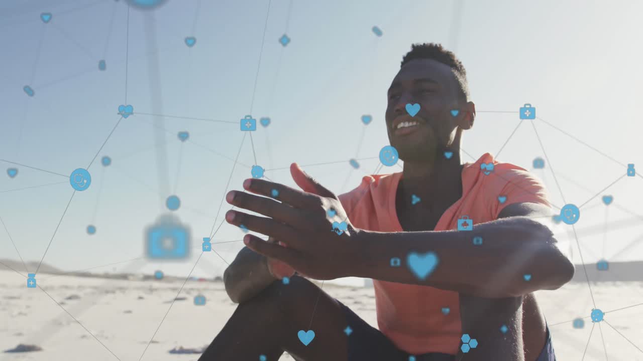 Animação de rede de conexões com ícones digitais sobre homem feliz na praia