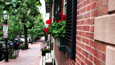 boston beacon hill neighborhood with federal-style rowhouses, narrow gaslit streets and brick sidewalks