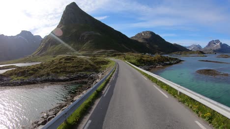 Driving-a-Car-on-a-Road-in-Norway-Lofoten.-Fredvang-Bridges-Lofoten-islands.