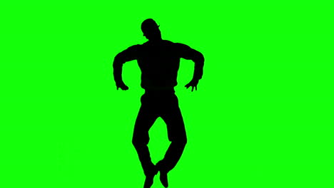 silhouette of a man jumping with hands on hips on green screen