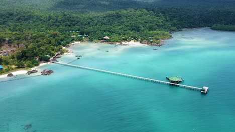 aerial landscape of beach resort with long pier and turquoise blue sea