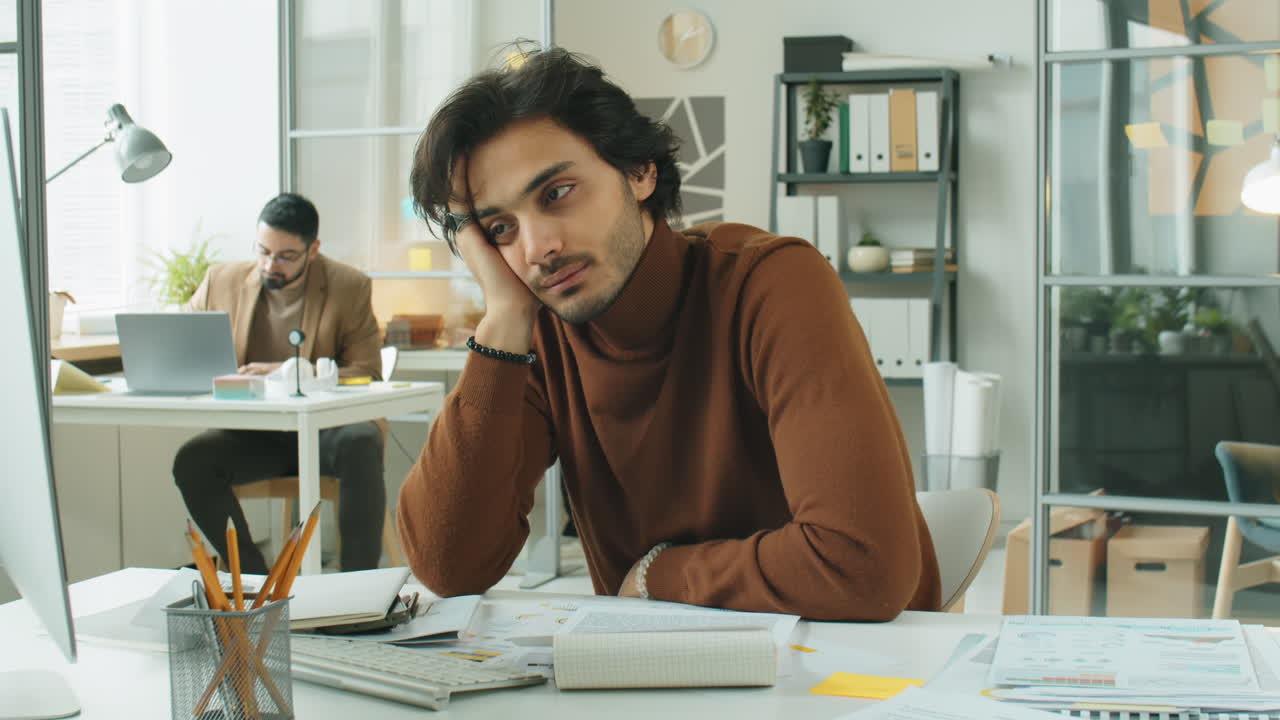 Time Lapse of Stressed Middle Eastern Businessman in Office