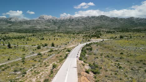 zadar county desert looking region of mountain velebit, a drone liftoff from a lonely road in summer croatia