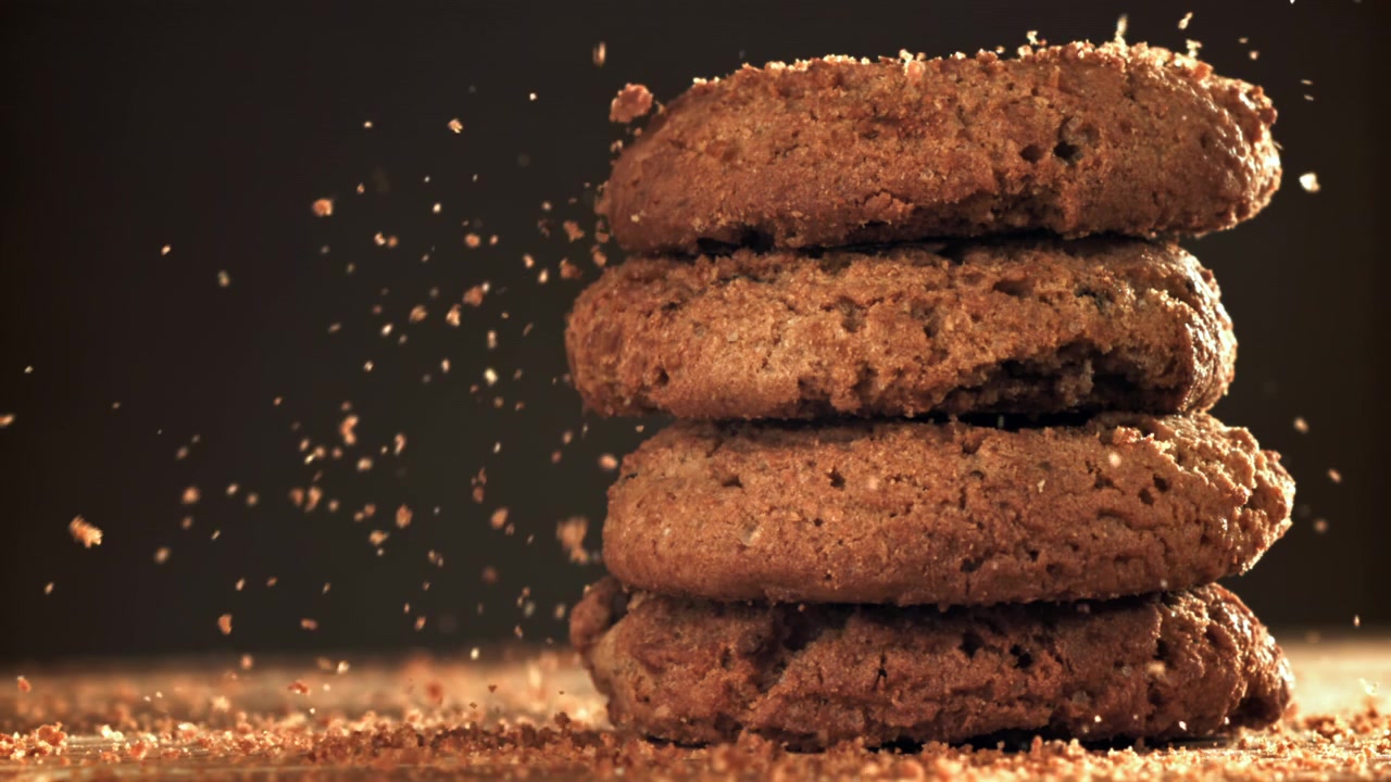 Slow Motion of Crumbs Falling on a Stack of Oatmeal Cookies