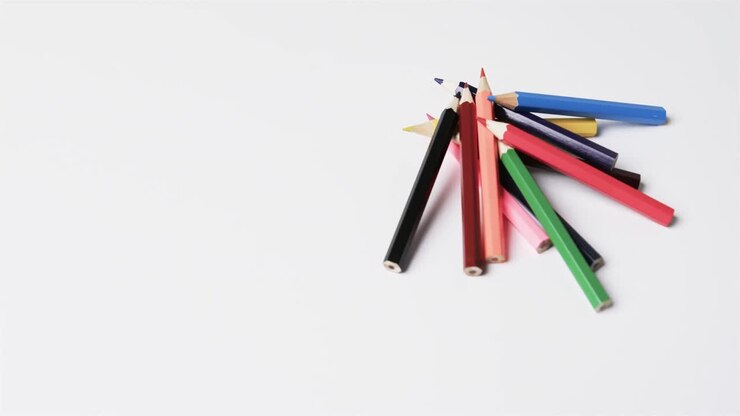 Close up of crayons with copy space on white background, in slow motion