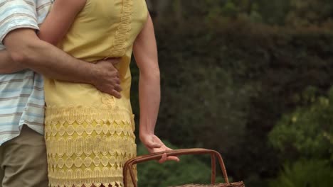 rear view of a mature couple with a basket