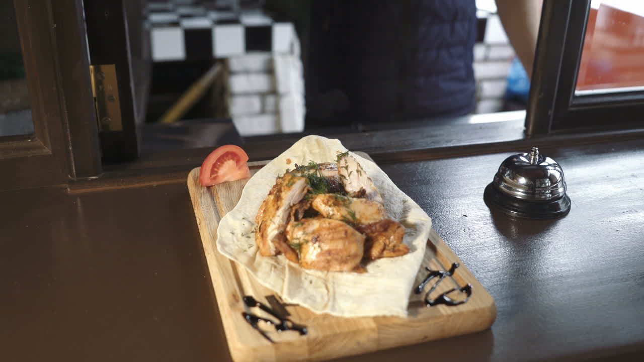 Very tasty cooked kebab on pita bread. Barbecue ready to serve in a restaurant. Delicious grilled meats.