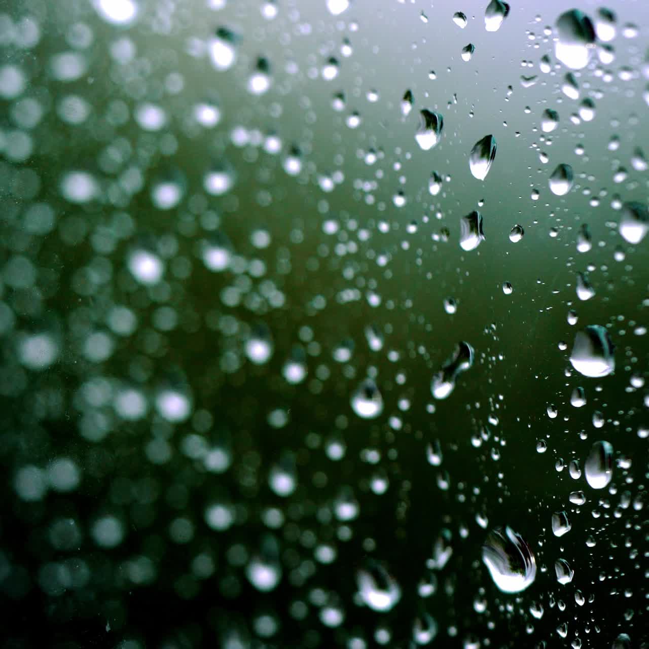 rain days, heavy rain falling on window surface