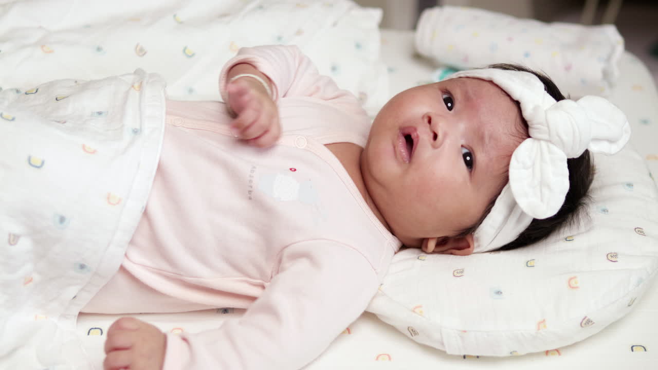 Adorable Baby Girl in White Headband Sleeping Peacefully