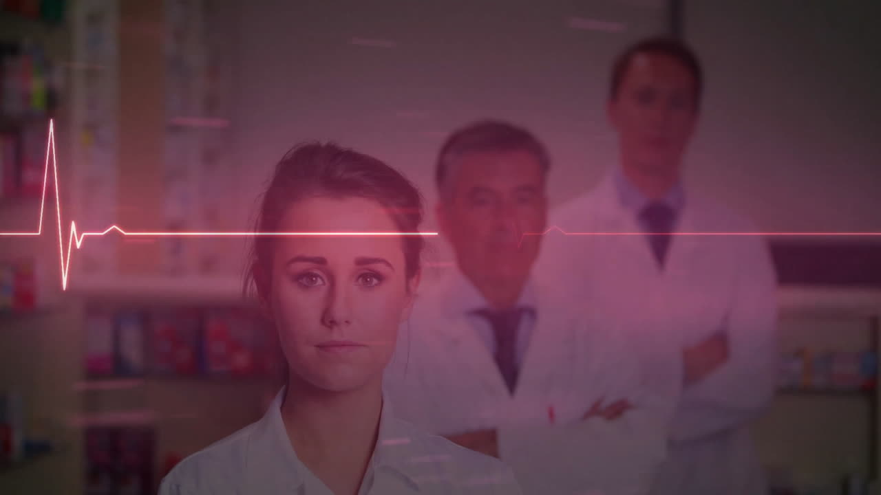 Animation of cardiograph over caucasian doctors with arms crossed