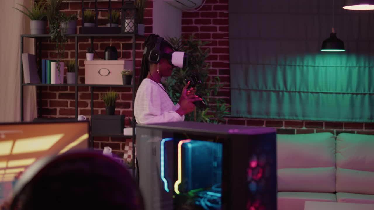 African american man playing multiplayer online action rpg on pc while girlfriend is fighting in virtual reality game