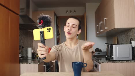 man vlogging in kitchen