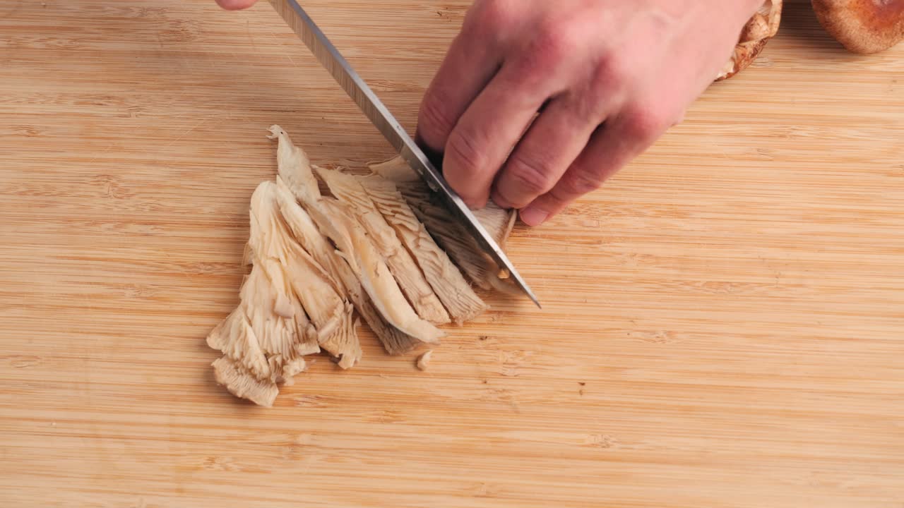 Chef Chopping Oyster Mushrooms