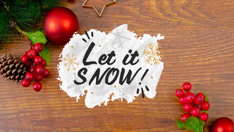 animation of let it snow christmas text and decorations on wooden background