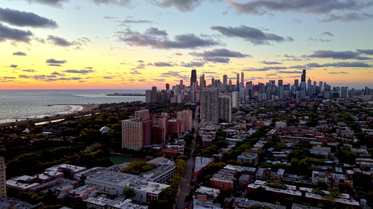 aerial push in to Chicago Illinois skyline at sunrise