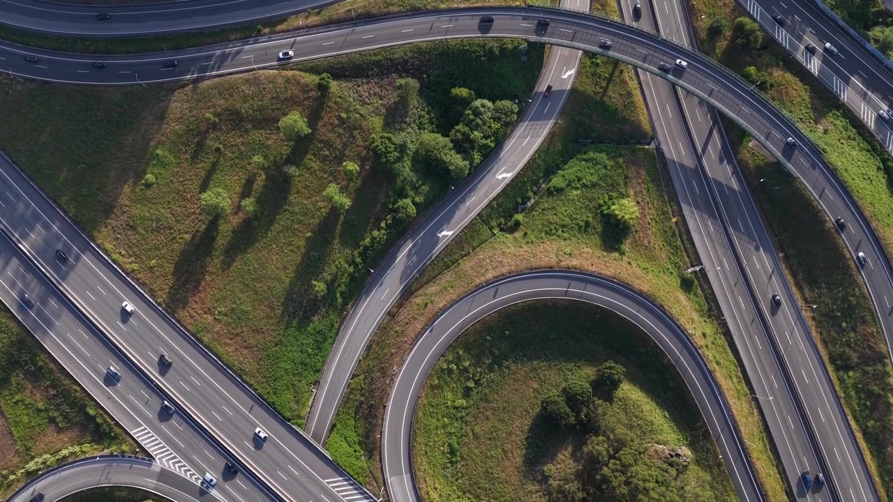 Bird’s Eye View of Interchanges and Viaducts During Rush Hour at Sunset