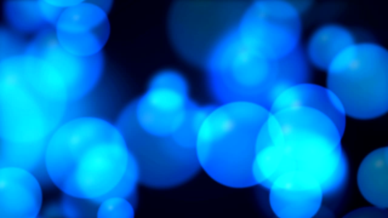 Abstrakter blauer Hintergrund mit leuchtenden Bokeh-Lichtern. Endlosschleife, 4K