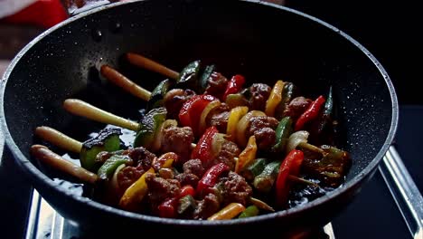 Cambodian-beef-kebabs-using-lemongrass-for-stick-or-sach-ko-ang-frying-on-a-pan,-authentic-khmer-local-dish