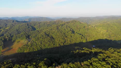 4K-Drone-Video-Flying-Above-Trees-Along-Mountain-Road-in-Smoky-Mountains-near-Asheville,-NC-on-Foggy-Morning