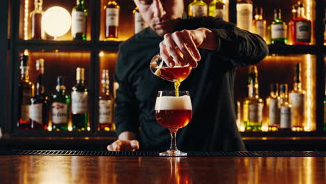 bartender making a drink at a bar