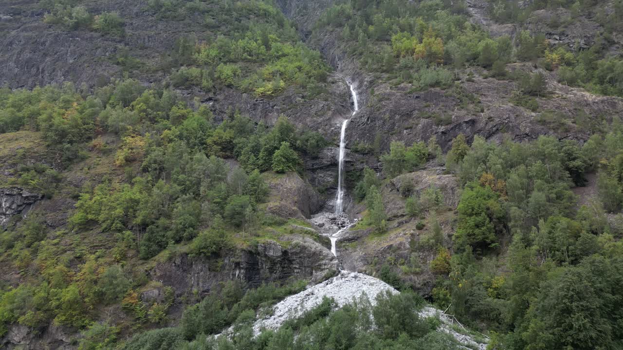 Approaching a vast waterfall in the Norwegian fjords