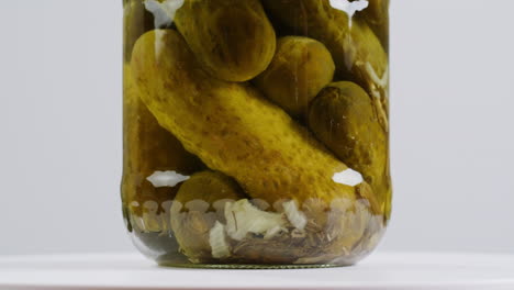 pickled cucumbers in a jar