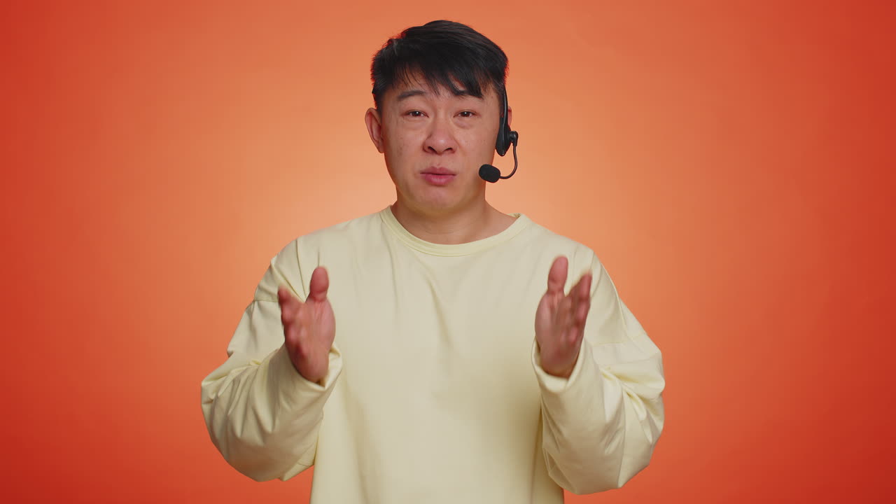 Man wearing headset freelance worker call center support service operator helpline communication