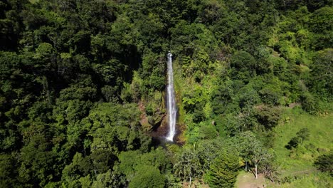 Drone-towards-cascade-in-middle-of-green-jungle-natural-scenario