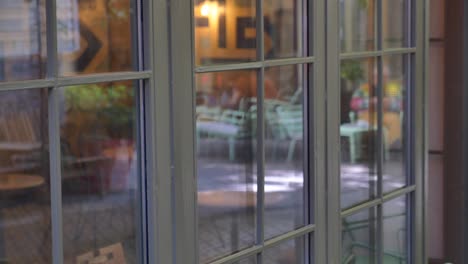 a close-up of a window with a view of a cafe interior