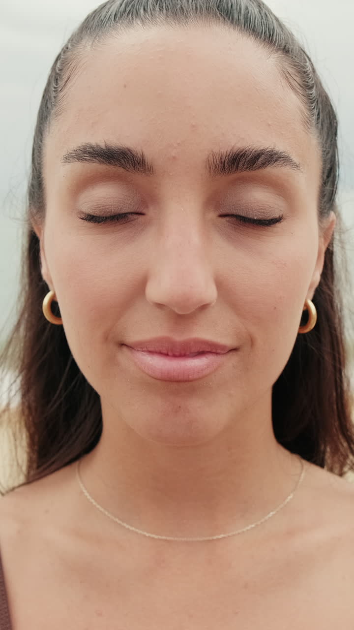 Serene Woman Smiles at Beach