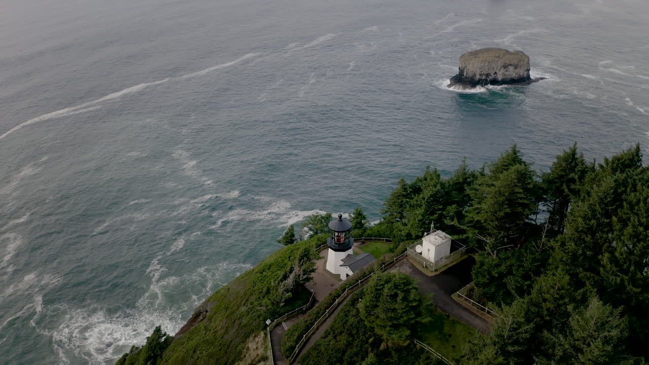 Aerial View of a Lighthouse and Sea Stacks on the Rugged Coastline