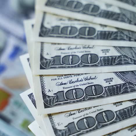 cash money background. rotation paper money. american one hundred dollar paper banknotes spinning slowly. rich background with 100 dollar bills.