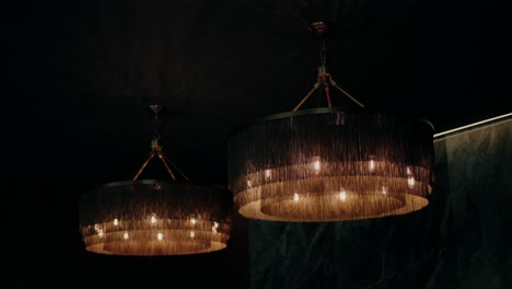 dimly lit modern chandeliers with warm lights, creating an elegant and intimate ambiance