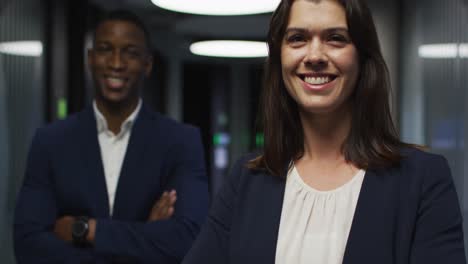 portrait of smiling diverse businesswoman and businessman in modern office