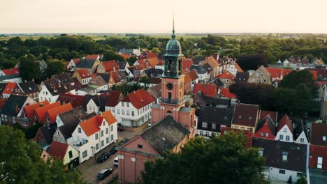 vivid medieval houses around church in small german town, crane shot