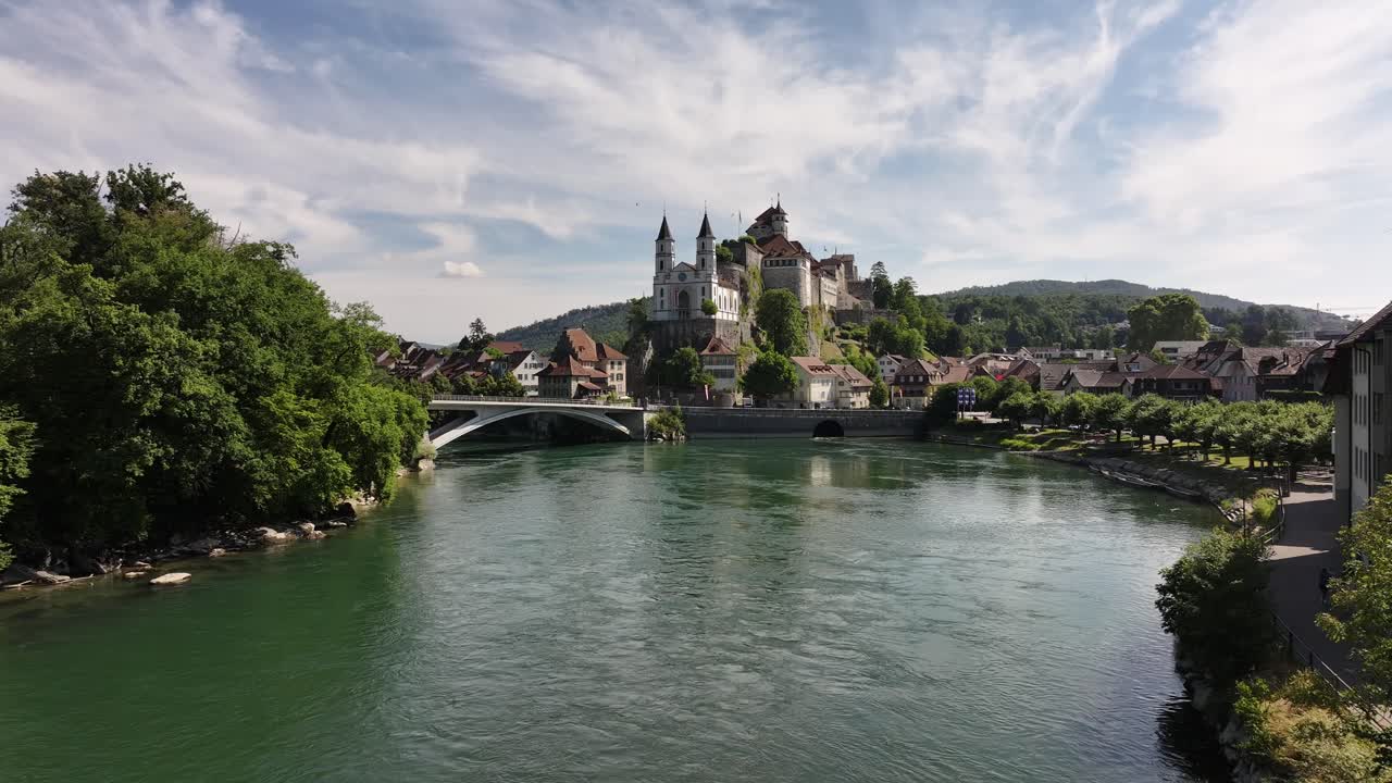 aerial - Aarburg Castle above Aare River with summer sky and old town in Solothurn Switzerland