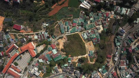 top down drone shot of buildings, landscaping near the city of da lat or dalat in the central highlands of vietnam on sunny day