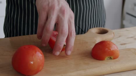 chef cutting tomatoes on a board
shot at 100fps 2