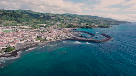 Ariel-shot-of-seashore-of-São-Miguel-Island-in-Portugal,-filled-with-beautiful-houses