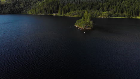 Aerial-view-of-a-little-island-in-a-lake-4K