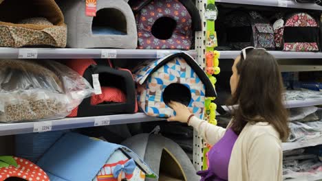 woman buying soft dog house at pet store