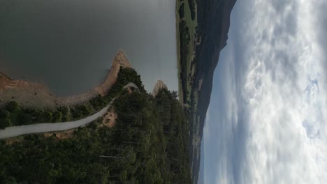 Rural-road-along-Huntsman-Lake,-Tasmania-in-Australia