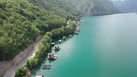 tara national park aerial view of serbia travel summer holidays destination with floating house boat on clear water lake mountains landscape