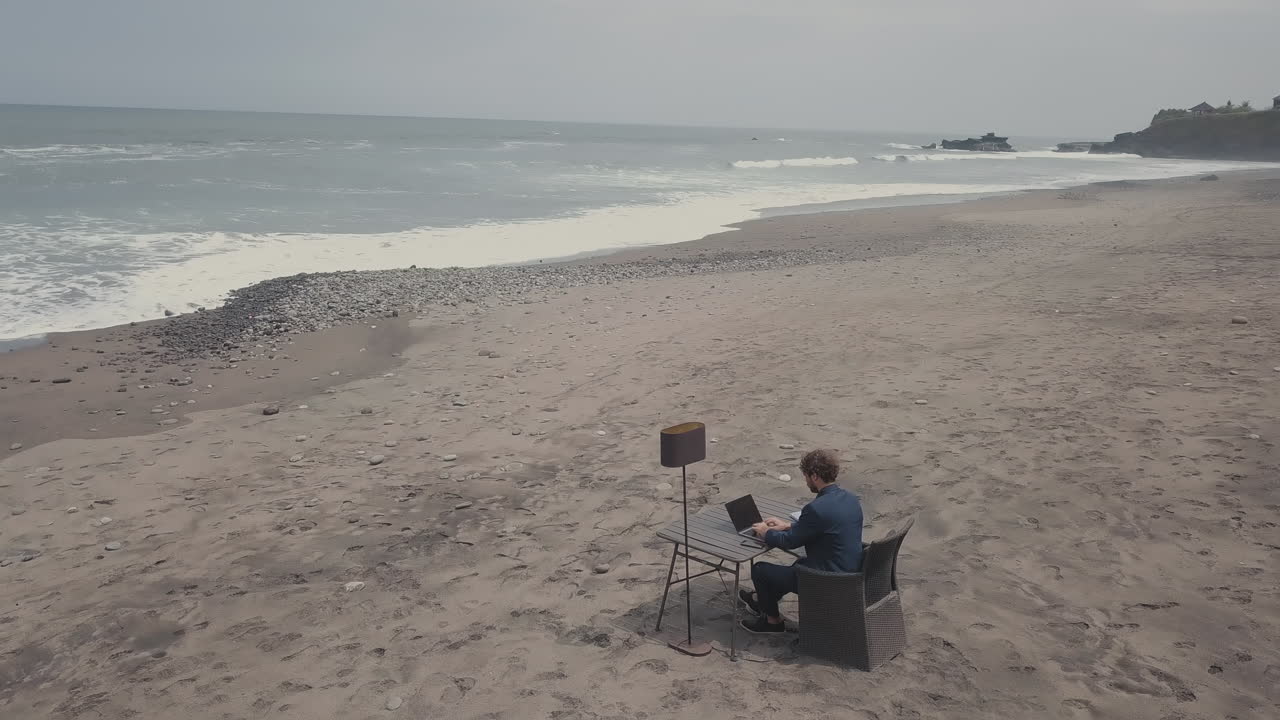 Man Working On Laptop On Sunny Day In Bali