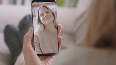 young-woman-having-video-chat-using-smartphone-at-home-chatting-to-friend-enjoying-conversation-sharing-lifestyle-on-mobile-phone-vertical-orientation-4k-footage
