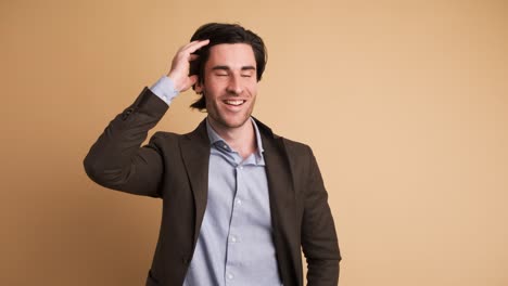 stunned businessman with opened mouth in brown studio